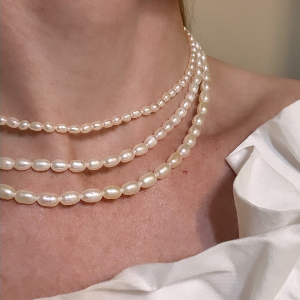Natural white rice pearl choker with gold filled chain.